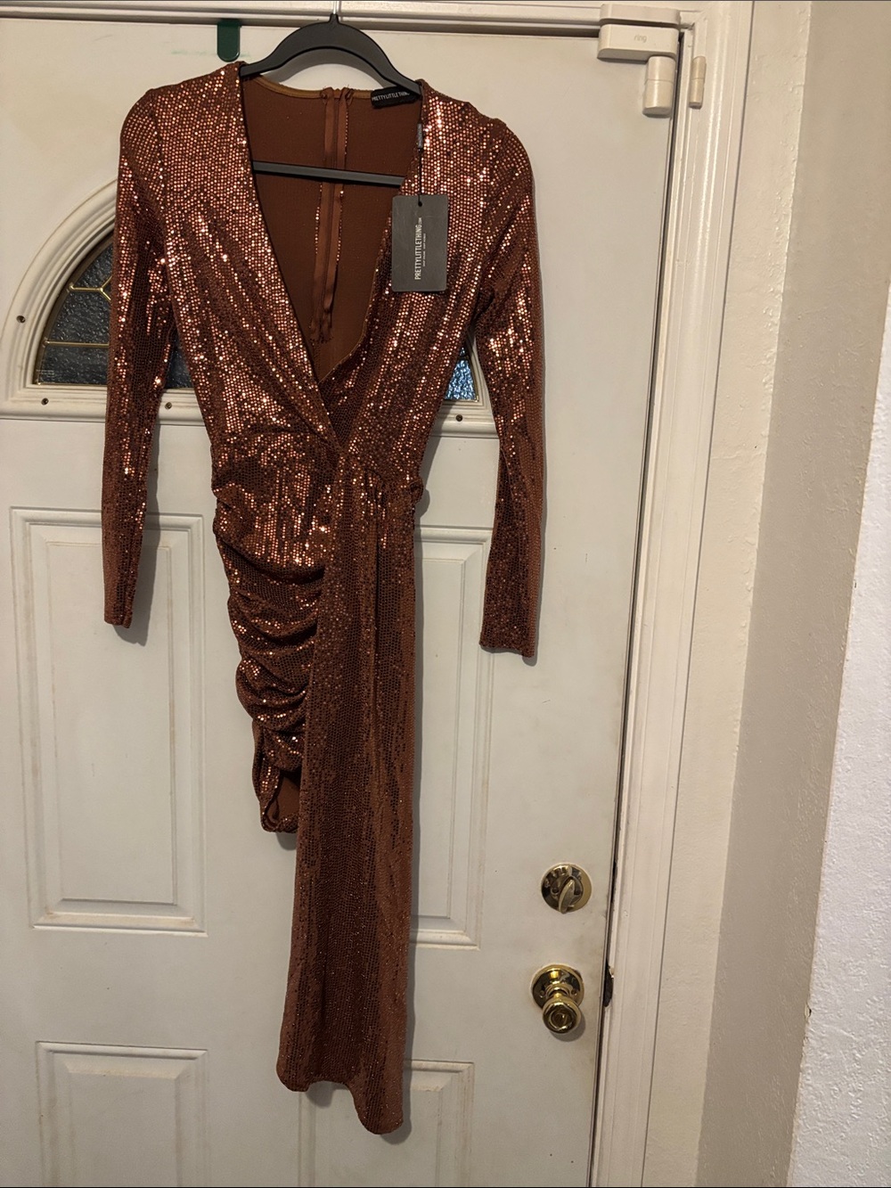 PrettyLittleThing Copper Sequin Asymmetrical Wrap Dress. It straches